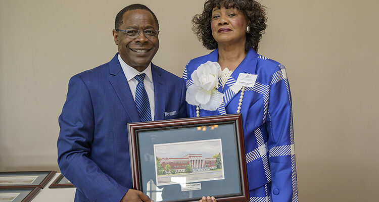 MTSU President Sidney A. McPhee, left, presents Cornelia Freeman Cooper, a new 1911 Society member, with a framed rendering of Kirksey Old Main at the seventh annual 1911 Society Luncheon held April 11 at the Stones River Country Club in Murfreesboro. The luncheon honors longtime and estate plan donors to MTSU. (MTSU photo by Andy Heidt)