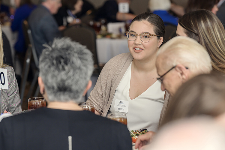 MTSU scholarship recipient Alexis Marshall, a graduating journalism and Spanish major, talks about her academic journey with those attending the seventh annual 1911 Society Luncheon held April 11 at the Stones River Country Club in Murfreesboro. The luncheon honors longtime and estate plan donors to MTSU. (MTSU photo by Andy Heidt)