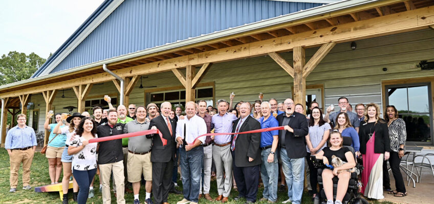 Invited guests, MTSU staff and administrators and Hop Springs owners and personnel participate in the Rutherford County Chamber of Commerce ribbon-cutting Thursday, May 23, to celebrate the grand opening of the facility and partnership with MTSU fermentation science. (MTSU photo by J. Intintoli)