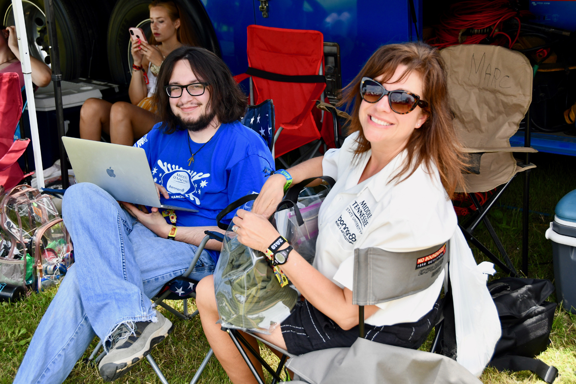 Taylor Sullivan, a music business and video production major at MTSU, gets up close to the action Sunday, June 16, while filming a concert on the Bonnaroo Who Stage in Manchester, Tenn. (MTSU photo by Andrew Oppmann)