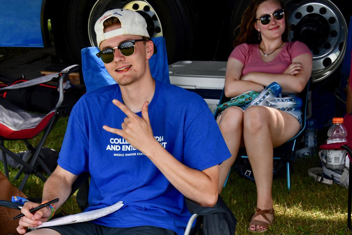 Taylor Sullivan, a music business and video production major at MTSU, gets up close to the action Sunday, June 16, while filming a concert on the Bonnaroo Who Stage in Manchester, Tenn. (MTSU photo by Andrew Oppmann)