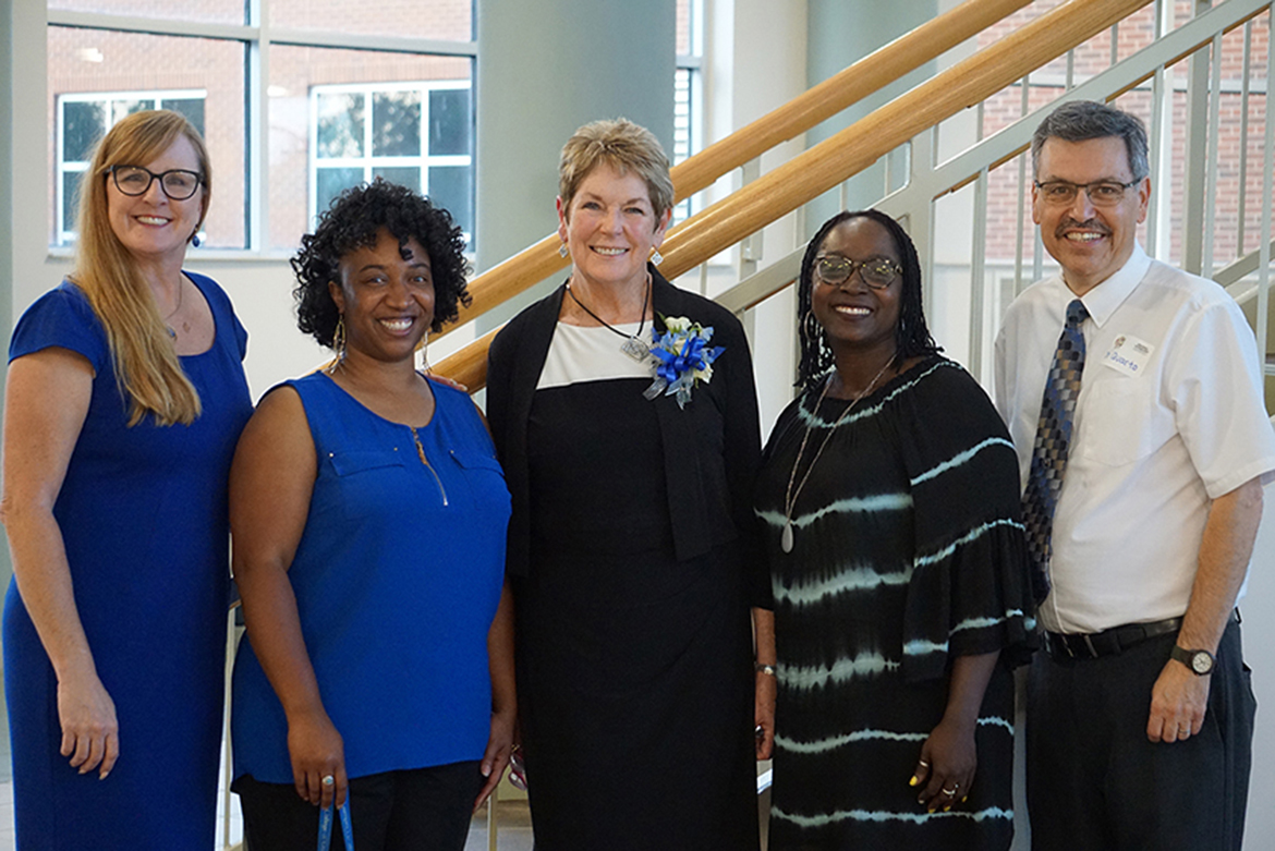 The faculty of the Professional Counseling Program poses at the Miller Education Building, where the June 15 reception celebrating the program’s 50th anniversary, took place. They are, from left, Robin Lee, program director; Tiffany Wilson, assistant professor; Virginia Dansby, retiring coordinator of the school counseling concentration; Michelle Stevens, associate professor; and Chris Quarto, professor. (Submitted photo)