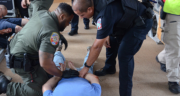 MTSU Police Cpl. Ricky Morales, right, and Rutherford County Sheriff’s Deputy Trey Mosby check on a “wounded victim” play-actor as part of a training session scenario held in early August inside MTSU’s College Heights Building as part of a comprehensive course to train more than 1,200 emergency responders across the county by the end of the year. (MTSU photo by Jimmy Hart)