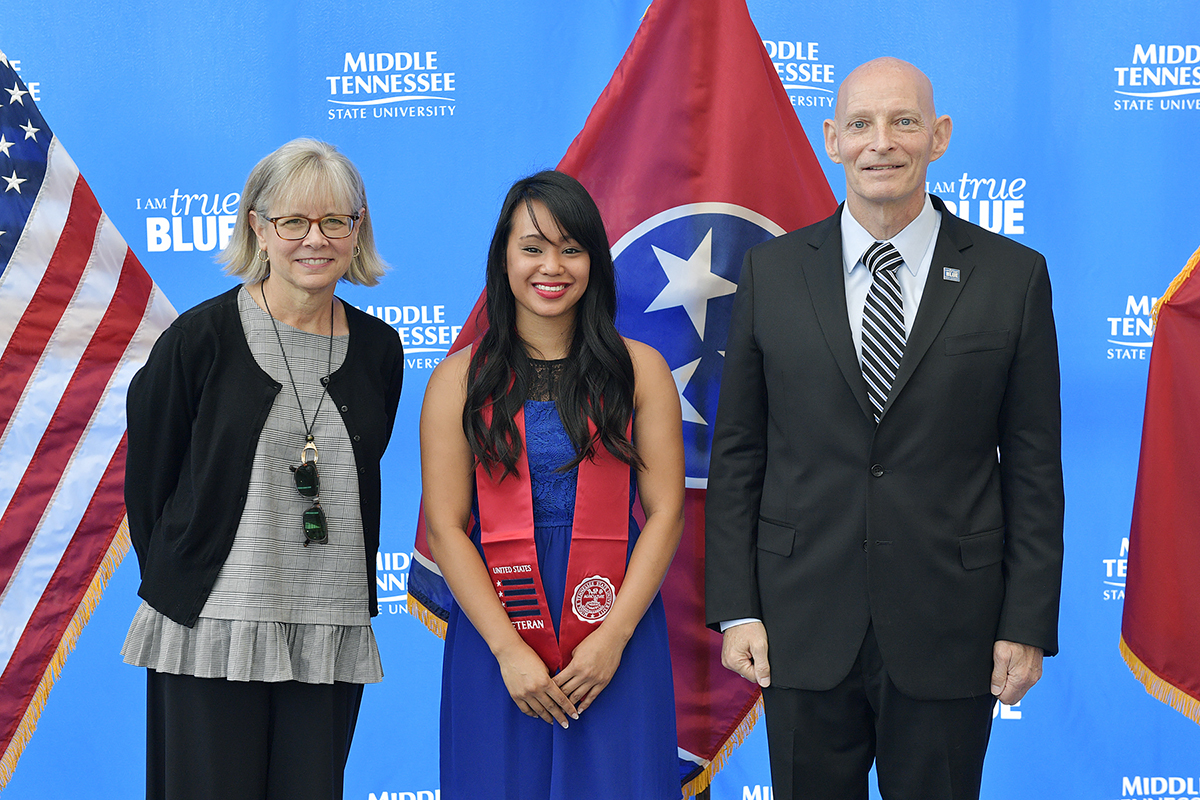 Deb Sells, left, MTSU’s vice president of Student Affairs and vice provost for Enrollment and Academic Services, Thuylinh Tran and Keith M. Huber, senior adviser for veterans and leadership initiatives and a retired U.S. Army lieutenant general, are pictured during the formal Graduating Veterans Stole Ceremony held Thursday, Aug. 1, in the Miller Education Center atrium and hosted by the Charlie and Hazel Daniels Veterans and Military Family Center. (MTSU photo by Andy Heidt)