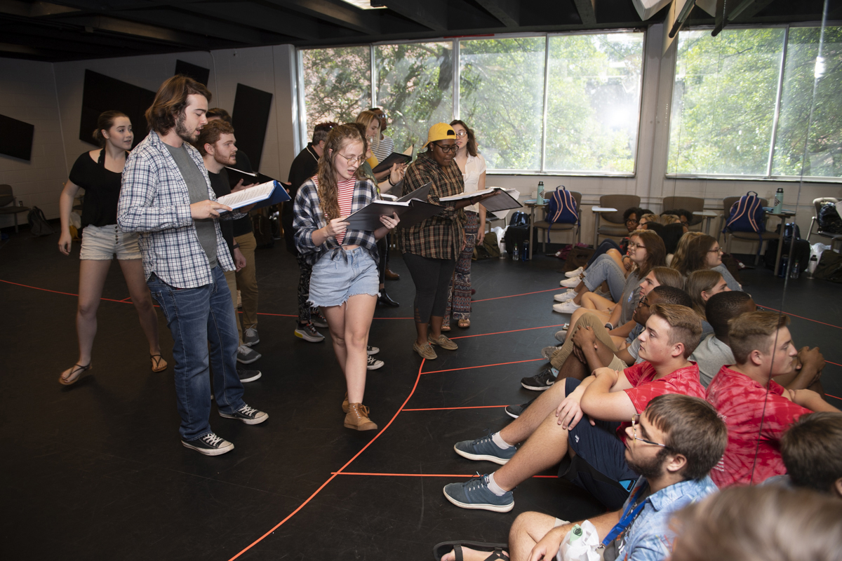 Blackman Collegiate Academy seniors, seated right, watch and listen Tuesday, Sept. 10, as MTSU associate professor Kristi Shamburger’s theatre and dance students perform a song, “Doors,” the opening song by Richard Maltby and David Shire in the musical, “Closer Than Ever,” which they will perform Dec. 5 in Tucker Theatre. Blackman High students made their first collegiate academy visit of the 2019-20 academic year. (MTSU photo by James Cessna)