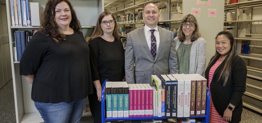 Wendy Jones, acquisitions assistant, left; Suzanne Mangrum, acquisitions librarian and interim chair of collection development and management; Dr. Jason Martin, interim dean, James E. Walker Library; Suzy Burkhardt, library assistant; and Anne Sayakhom, acquisitions assistant. (MTSU photo by Andy Heidt)