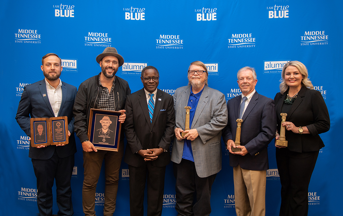 MTSU President Sidney A. McPhee, third from left, greeted the 2019-20 MTSU Distinguished Alumni: Aaron Shew, left, Young Alumni Achievement Award; Jeremy Cowart, overall Distinguished Alumnus; and Citations of Distinction recipients Carroll Van West (Achievement in Education/MTSU faculty), G. Edward Hughes (Achievement in Education/non-MTSU); and Meagan Flippin (Service to Community). The awards were presented Friday, Oct. 25, in the Ingram Building’s MT Center. The nomination deadline for 2020-21 Distinguished Alumni is May 1. (MTSU file photo by James Cessna)