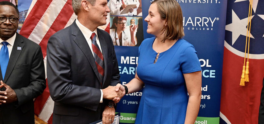 MTSU freshman Claire Ritter, right, shakes hands with Tennessee Gov. Bill Lee after Lee presented her with a special certificate Thursday, Oct. 3, in the State Capitol in Nashville. Ritter was one of six students recognized Thursday for their acceptance into the inaugural class of the Medical School Early Acceptance Program, a partnership between MTSU and Meharry Medical College to fast-track students to a medical degree in seven years through course work at both institutions. At far left is MTSU President Sidney A. McPhee. (MTSU photo by Andy Heidt)