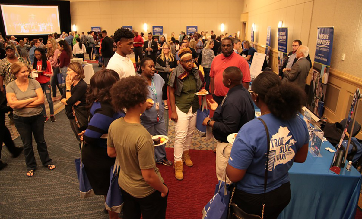 MTSU’s Travis Strattion, second from right, tells a group of prospective students and their parents about the Office of Student Success and other MTSU departments share about their opportunities Tuesday, Oct. 29, during the True Blue Tour in Chattanooga, Tenn., at the Chattanooga Convention Center. (MTSU photo by John Goodwin)