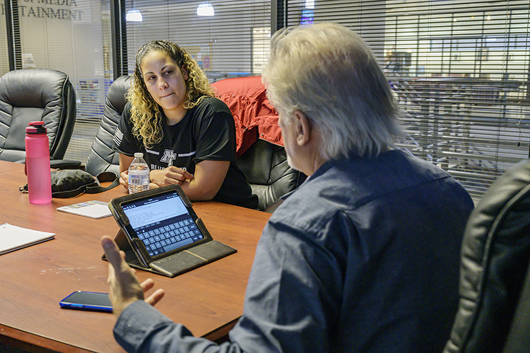 Jessica Pierson of Murfreesboro, a U.S. Army veteran and MTSU alumna who works as transition manager for the university's Charlie and Hazel Daniels Veterans and Military Family Center, listens intently to songwriter Steve Williams as they work on a song encompassing Pierson's story during their writing session at Operation Song's fourth annual “Songs and Stripes” event at MTSU Friday, Oct. 25. The event teams trios of military veterans, student and professional songwriters to create healing music for the veterans and training for the students. Not pictured is Yui Hasegawa, a senior commercial songwriting major and native of Osaka, Japan. (MTSU photo by Andy Heidt)