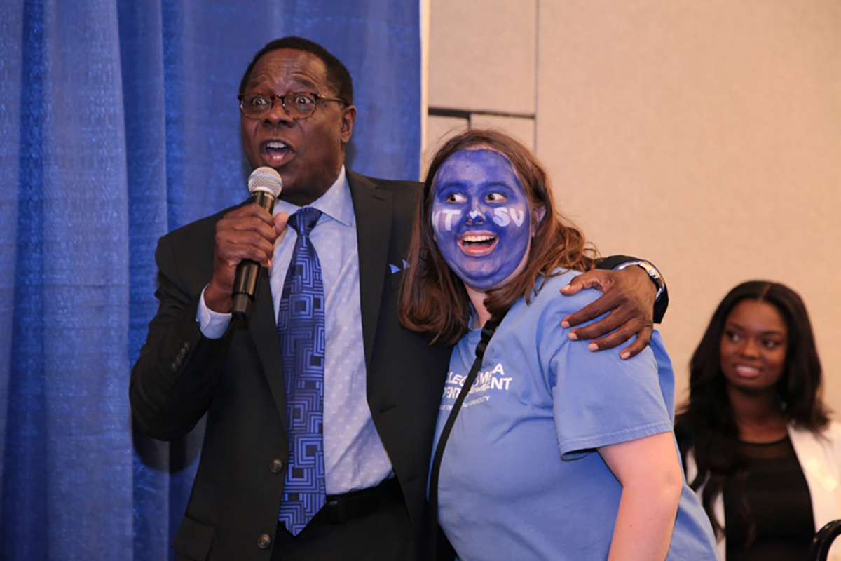 MTSU President Sidney A. McPhee, left, carries on with Sallie Rawlston of Soddy-Daisy, Tenn., Tuesday, Oct. 29, during the annual True Blue Tour event at the Chattanooga Convention Center. She received a combined $8,500 in scholarships from the university. (MTSU photo by John Goodwin)