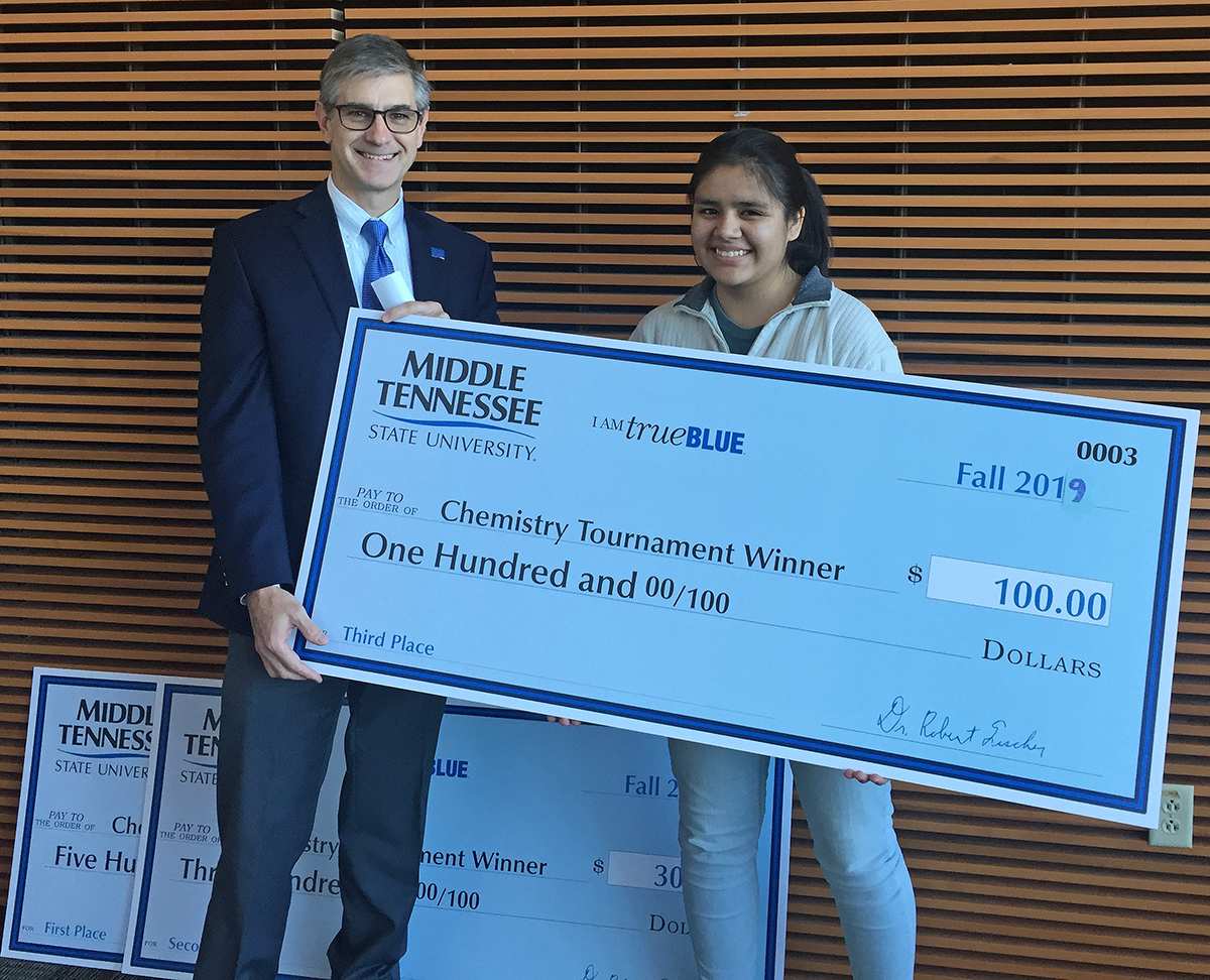 MTSU Department of Chemistry Chair Greg Van Patten, left, awarded Lizbeth Lozano a $100 cash prize for being the top junior winner in the 2019 Chemistry Scholarship Tournament, held in the Science Building on campus. Lozano is a student at Central Magnet School in Murfreesboro. (Submitted photo)