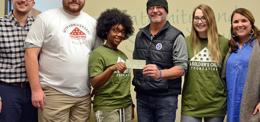 The Office of Fraternity and Sorority Life at MTSU celebrates the donation of a check for more than $6,800 to the A Soldier’s Child Foundation. From left are Jordan Borchert, coordinator, Fraternity and Sorority Life; Nate Parris, president-elect, Interfraternity Council; Terranny McLean, vice president of programming, National Pan-Hellenic Council; Daryl Mackin, founder and executive director, A Soldier’s Child Foundation; Alyssa Marchman, president-elect, National Pan-Hellenic Council; and Leslie Merritt, director, Fraternity and Sorority Life. (MTSU photo by Gina Logue)