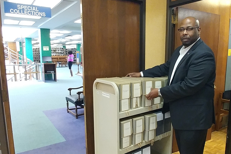 MTSU alumnus Brandon Owens is shown on the job as assistant librarian for technical services at the John Hope and Aurelia E. Franklin Library at Fisk University in Nashville, Tennessee. Owens is a graduate of MTSU’s Master of Library Science online program. (Photo courtesy of Clarke Bagsby/Fisk University)