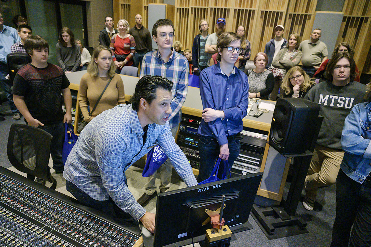 MTSU recording industry professor Matt Foglia, foreground, demonstrates to prospective students and their parents how the state-of-the-art equipment works in Studio A in the Bragg College of Media and Entertainment Monday, Feb. 17, as part of the Honors College Presidents Day Open House. Hundreds of students toured the campus and met various deans, faculty, department chairs and administrators. (MTSU photo by Andy Heidt)