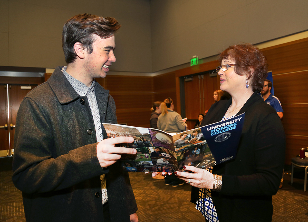 Ross Sibley, left, of Redlands, Calif., learns more about the MTSU Honors College from staff member Susan Lyons Monday, Feb. 17, in the Student Union Ballroom during the college’s annual Presidents Day Open House. Sibley has been offered an Honors College Buchanan Fellow — the best scholarship MTSU offers a prospective student. (MTSU photo by Marsha Powers)