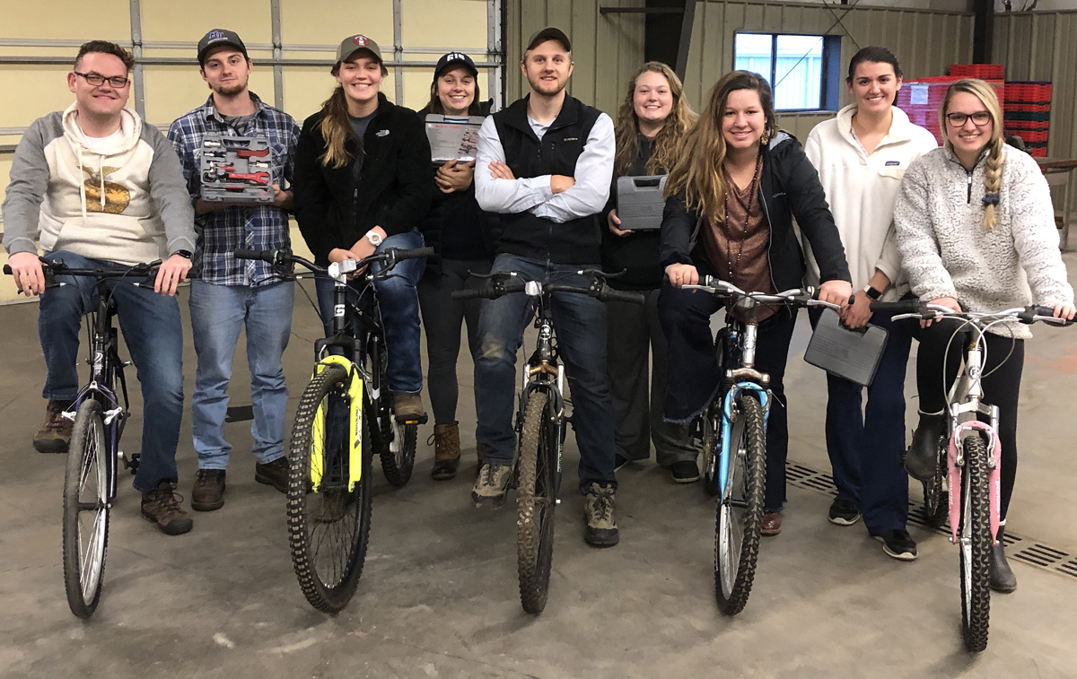 Hunter Holden, left, Blake Warmack, Madison Caudill, Abbey Taylor, Brendon Puckett, Taylor Bell, Lindsey Parsley, Sara Beth Martin and Jessie Hickerson Stand with the bicycles they repaired and donated to Murfreesboro’s Greenhouse Ministries earlier this year. The bikes will help homeless people have transportation for jobs. One bicycle had welding issues. (Submitted photo)