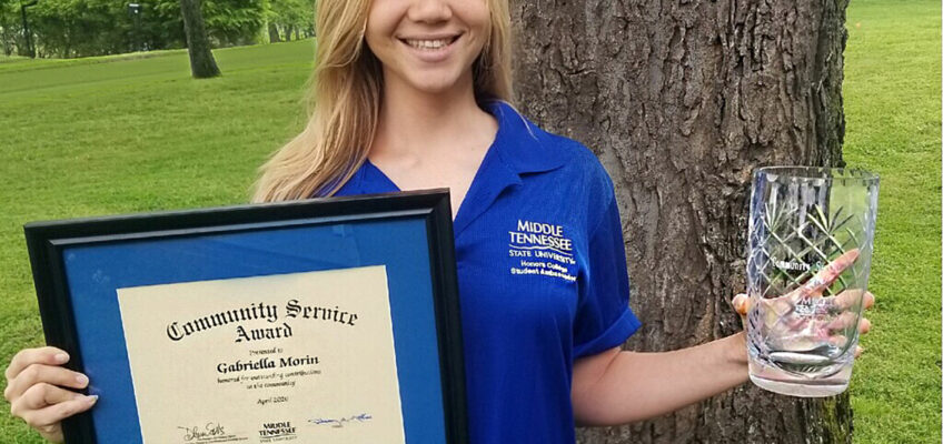 Rising senior Ella Morin of Knoxville, Tenn., recently received the MTSU Student Organizations and Service Community Service Award for 2019-20. The Honors College rising senior is shown with the vase and plaque with accompanying certificate. She also was named one of five Harold Love Sr. Award college honorees earlier this year. (Submitted photo)