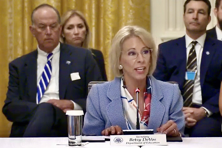 A screenshot from a video showing MTSU Board of Trustees Chairman Stephen B. Smith, back left, watching Education Secretary Betsy DeVos speak at a White House panel Tuesday on plans to reopen the nation’s schools and universities this fall.