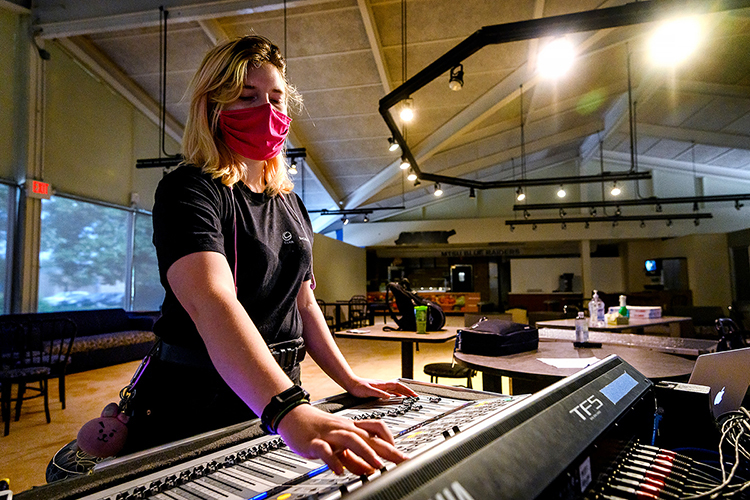 MTSU audio production alumna Ashley Mills adjusts sound levels on the music during rehearsals with the indie rock/pop band Shelter Cove in the university's Chris Young Café on campus. The band, which includes MTSU students and alumni who perform on the university's student-run label, Match Records, is performing with four other Nashville-area artists Tuesday, Sept. 22, in “Rock the Vote at Belmont University: Nashville Colleges Celebrate Democracy," a nationwide National Voter Registration Day virtual event to get Americans registered and ready to vote in the Nov. 3 elections. (MTSU photo by J. Intintoli)