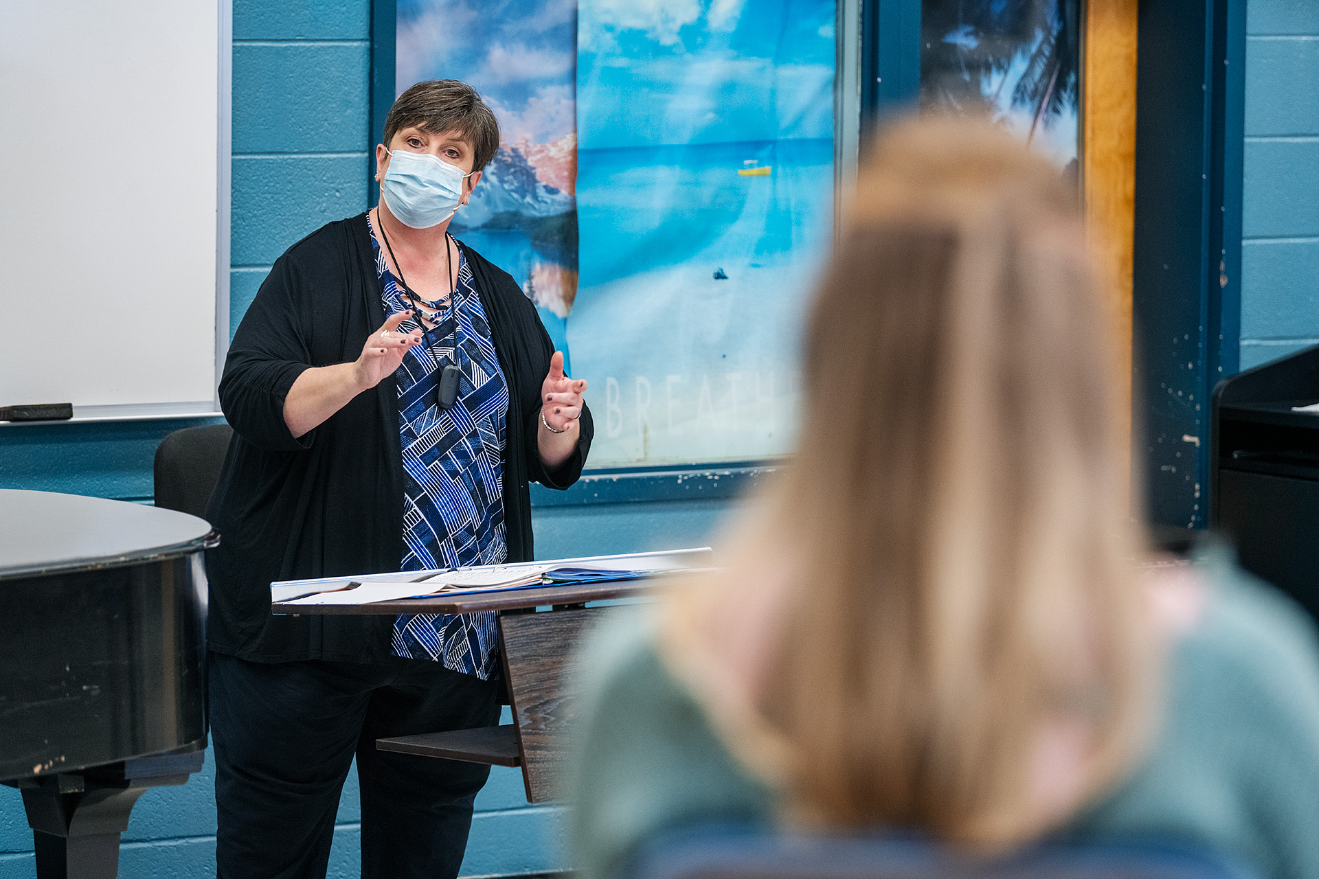 Angela Tipps, Instructor in the School of Music, teaching a portion of the Women’s Chorale in the Saunders Fine Art Building. (Photo: Andy Heidt)