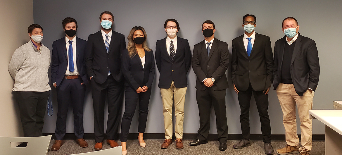 Members of MTSU’s National College Fed Challenge team recently filmed their video presentation inside the Business and Aerospace Building. The presentation, in which the student team made policy recommendations about the current economy, was submitted to representatives with the Federal Reserve for judging. Pictured, from left, are Dr. Anne Anderson, Weatherford Chair of Finance; seniors Aaron Stagner, a history major with an economics minor from Altoona, Iowa; Kyle Chandler, an economics major from Murfreesboro, Tenn.; Emma Praskach, an economics major from upstate New York; alternate Garrett Thurman, an economics major from McMinnville, Tenn.; Kannan Akins, an economics major from Lebanon, Tenn.; Joshua Smith, economics major from Nashville, Tenn.; and Dr. Stuart Fowler, economics professor. (MTSU photo by Jimmy Hart)