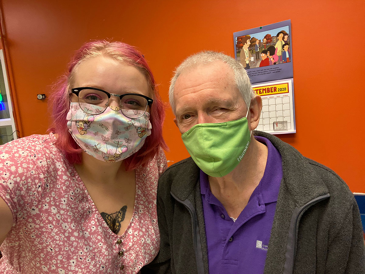 Dwight and his daughter Miranda pose for a picture in Dwight's Mini Mart