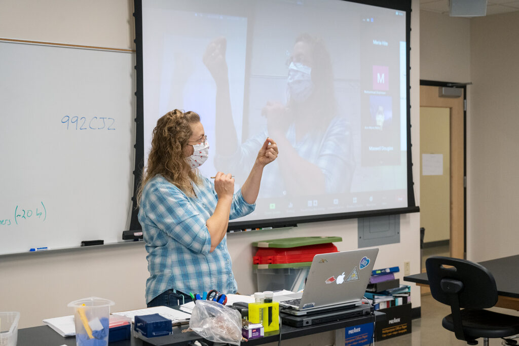 Rebecca Seipelt-Thiemann teaching her Honors Genetics class in the Science Building.
