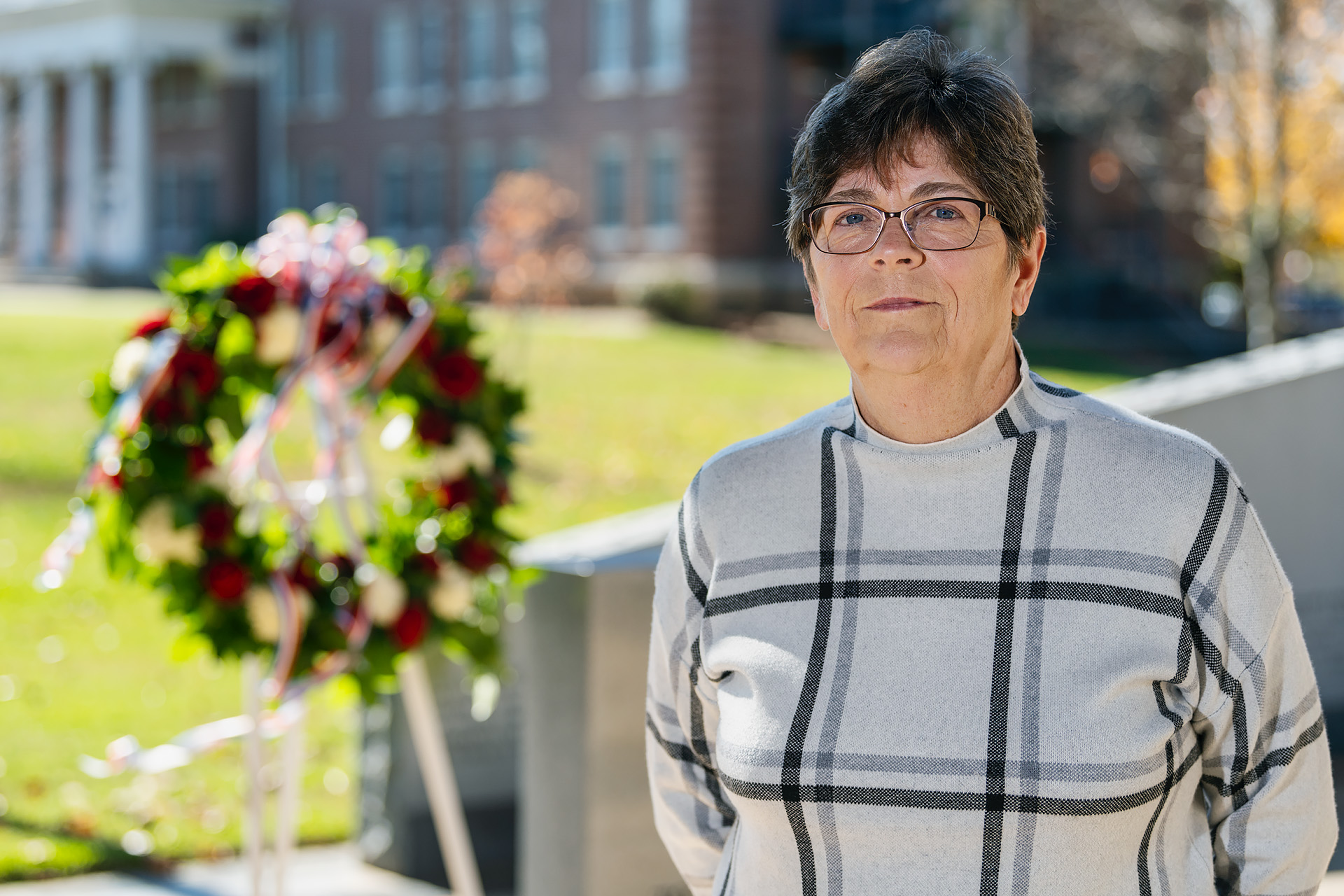 Rebecca Calahan, Mathematical Sciences faculty at the Veterans Memorial. (Photo: Andy Heidt)