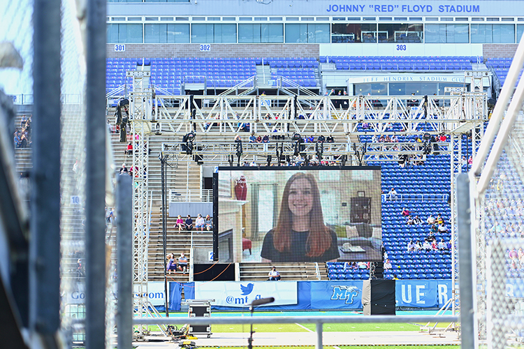 A graduating student's thank-you video plays on the Jumbotron in MTSU's Floyd Stadium Saturday, Nov. 21, before the university's fall 2020 commencement ceremonies. MTSU, which held virtual graduations for its May and August graduates because of the pandemic, required strict health protocols for the graduates and limited their guests to help keep the three open-air events safer. (MTSU photo by Cat Curtis Murphy)