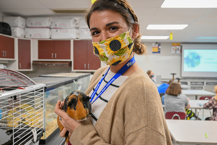 MTSU teacher candidate student Sarah Martin shows off a guinea pig at Eagleville High School in Eagleville, Tenn., on Oct. 14, 2020. (MTSU photo by Stephanie Barrette)