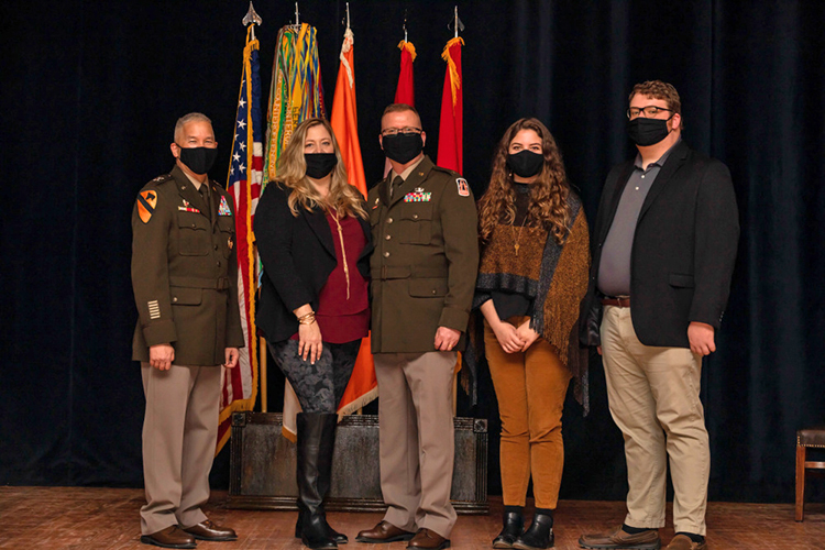 U.S. Army Reserve Brig. Gen. Robert Powell Jr., center, poses for a photo with his family and Maj. Gen. Stephen Hager, far left, during his promotion ceremony at Fort Gordon, Georgia, Dec. 15, 2020. With the promotion, Powell will serve as the deputy commanding general 335th Signal Command (Theater). Also pictured are Powell's wife Jill, second from left, daughter Mary Kate, and son Stone. (U.S. Army photo by Capt. David Gasperson)