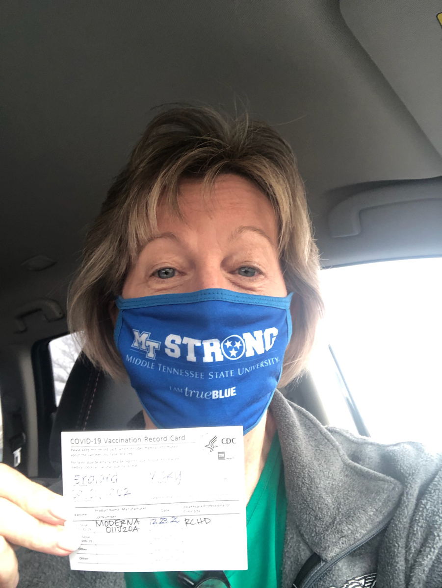MTSU nurse Vicky England holds her COVID vaccine reminder card to receive the second dose of the Moderna vaccine after getting the first dose Wednesday, Dec. 23, at the Siegel High School Gym in Murfreesboro. About 12 MTSU staff members were among dozens of health care workers and first responders receiving the vaccine. (MTSU photo by Jason Schrader)