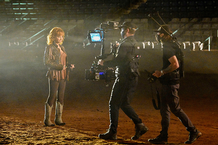 Middle Tennessee State University alumnus Tony Reyes, steady camera operator, middle, and Shaun Silva, director, right, work with country music superstar Reba McEntire during the music video shoot for her new single with artist Cody Johnson “Dear Rodeo” at MTSU’s Tennessee Miller Coliseum in Murfreesboro, Tenn., on Oct. 1, 2020. (MTSU photo by Andy Heidt)