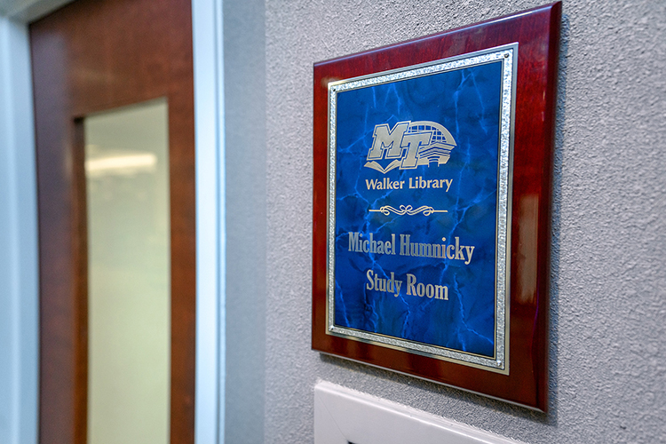 This plaque identifies the study room behind the door as the Michael Humnicky Study Room at the James E. Walker Library to honor a devoted donor of books and funding. (MTSU Photo by j. Intintoli)