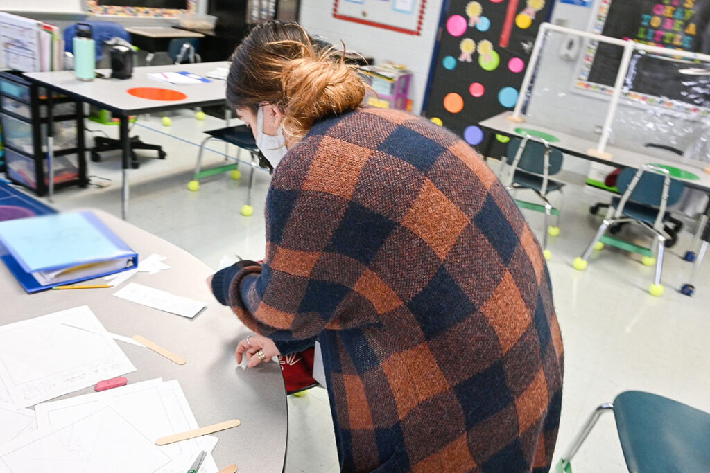 Corinne Keene, special education teacher and former Middle Tennessee State University student, helps one of her students with an arts and crafts project at Wilson Elementary School in Murfreesboro on Jan. 15, 2020. (MTSU photo by Stephanie Barrette)