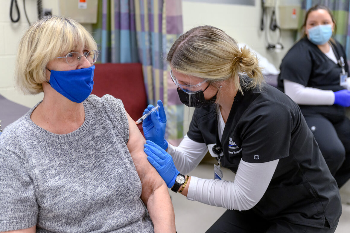 Marilyn Vetter of Murfreesboro receives her free Moderna COVID-19 vaccination from MTSU School of Nursing student Andrea Jones Thursday, Feb. 25, in the Cason-Kennedy Nursing Building clinical area. Eligible residents must make appointments to receive the vaccine, which is a partnership between the School of Nursing and the Rutherford County Health Department. (MTSU photo by J. Intintoli)