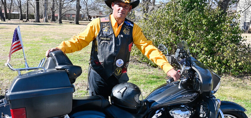 Leroy Carter, Middle Tennessee State University police officer, stands in his Buffalo Soldiers and Troopers Motorcycle Club uniform with his 2012 Yamaha V Star 1300 Tourer bike on campus on Feb. 5, 2021. (MTSU photo by Stephanie Barrette)