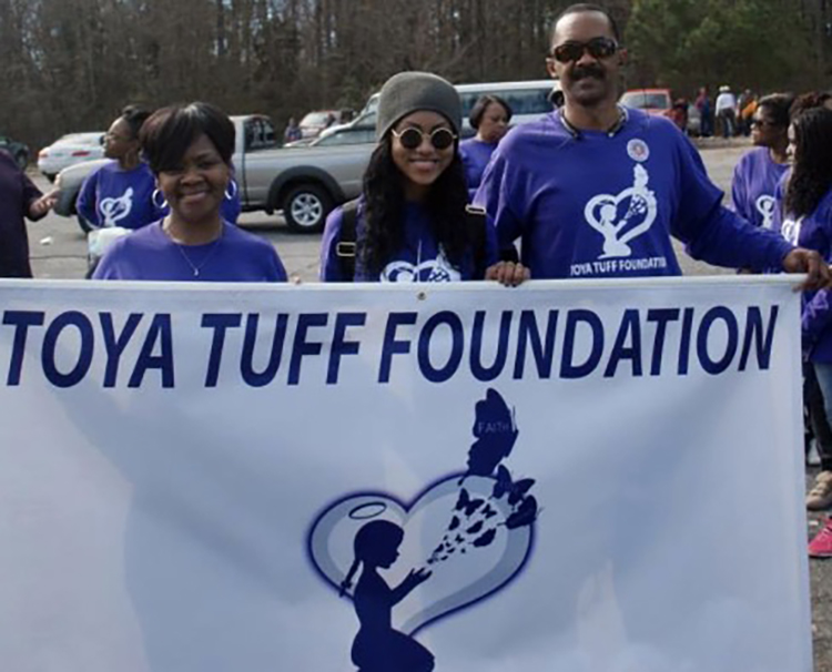 In this undated photo, Middle Tennessee State University alumnus Ed Stegall, right, is pictured with his wife, Barbara, left, and daughter, Michelle, at an event for the Toya Tuff Foundation. The Stegall family created the foundation in memory of LaToya Stegall, who had cerebral palsy and subsequently passed away. The foundation provides assistace to special needs children. (Submitted photo)
