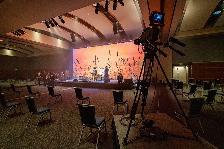 Students from three departments across MTSU's College of Media and Entertainment and the College of Liberal Arts work together in the Student Union ballroom Wednesday, March 24, to set up for the Briston Maroney concert. Department of Media Arts students designed and built the 40-foot-by-18-foot video wall onstage and filmed the socially distanced show to stream live, while Department of Recording Industry students perfected the sound and Department of Theatre and Dance students provided the lighting expertise. (MTSU photo by Andy Heidt)