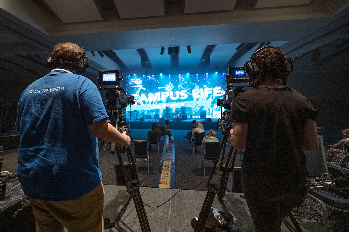 MTSU senior video and film production majors Nathaniel Muncie, left, of Johnson City, Tennessee, and Brea Robbins of Cookeville, Tennessee, focus on the stage, featuring a student-constructed 40-foot-by-18-foot video wall, on Wednesday, March 24, between acts at the Briston Maroney concert in the Student Union ballroom. The Department of Media Arts students in MTSU's advanced multi-camera TV production course were among nearly 50 students from two different colleges — and three departments — who collaborated to present MTSU's first in-person, large-scale "Signature Event" since 2019. (MTSU photo by Cat Curtis Murphy)