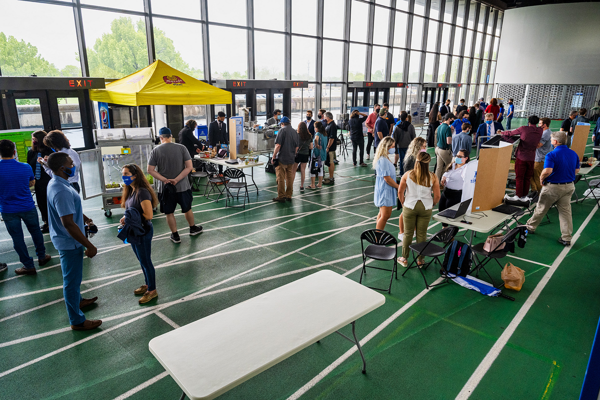 An overview of the crowd attending the spring 2021 Engineering Technology Mech-Tech Expo on the track level inside Murphy Center Thursday, April 29. Students presented their senior projects and posters, which were judged by industry professionals. (MTSU photo by Andy Heidt)