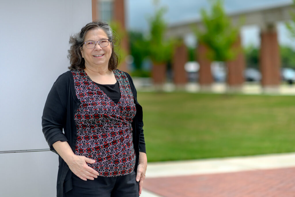 Service to students portrait of Trish Hayes, Social Work at the Academic Classroom Building.