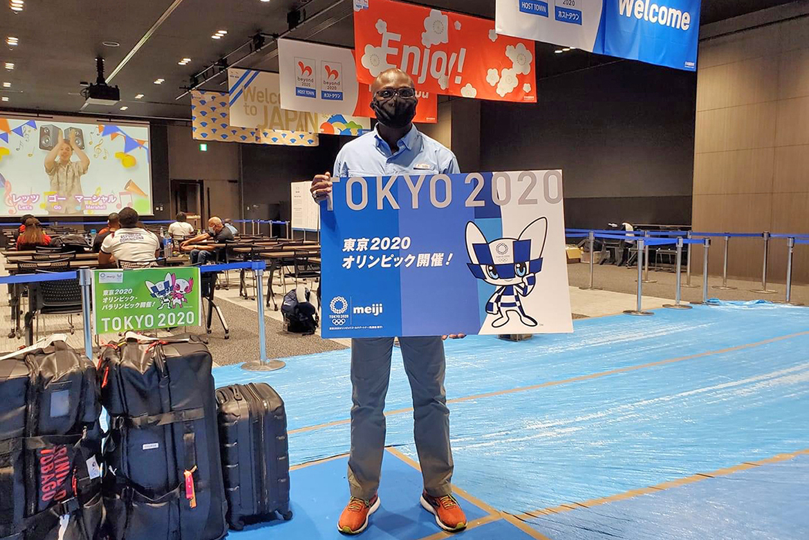 Dr. Andrew Owusu, assistant professor of health and human performance and adviser to Ghana's men's track and field team, poses at the airport in Tokyo, Japan, site of the 2021 Summer Olympics. (Photo provided)