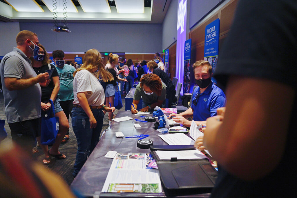 MTSU academic representatives at the MT One Stop answer questions about financial aid, scholarships and more in August 2021 during the annual True Blue Tour kickoff event in the Student Union Ballroom on campus. MTSU visits eight more Tennessee cities, plus Atlanta, Huntsville and Birmingham, Ala., and Louisville and Lexington, Ky. The kickoff tour event starts at 6 p.m. Wednesday, Aug. 17, in the MTSU Student Union Ballroom in Murfreesboro. (MTSU file photo by Cat Curtis Murphy)