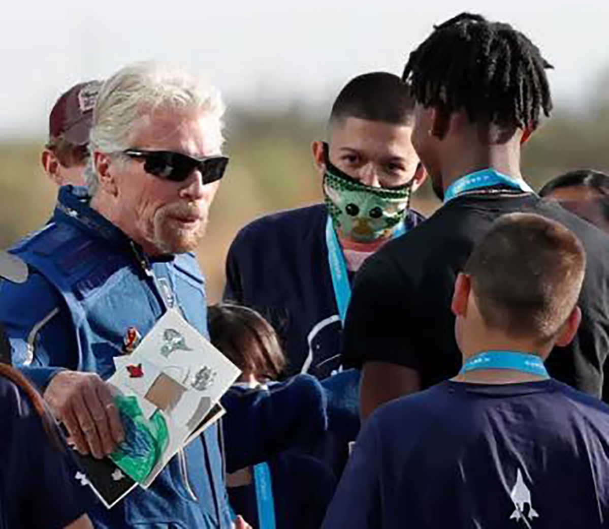MTSU junior aerospace pro pilot major Mike Harris of Americus, Ga., has a brief face-to-face meeting with billionaire Virgin Galactic founder Richard Branson as he was heading to a car that would drive him to the spaceship Unity July 11. Harris is an intern in the program this summer. (Submitted photo)