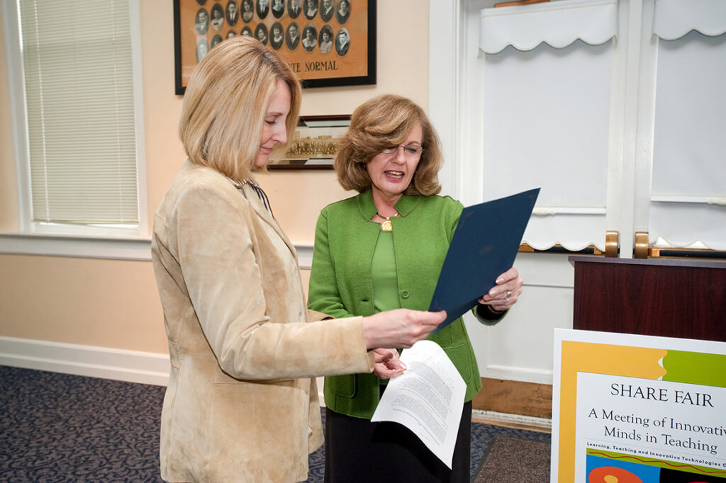 Barbara Young, Middle Tennessee State University education professor, left, receives the award for innovation in Teaching, Learning and Technology from Lucinda Lea, MTSU vice president emeritus for information technology and chief information officer, in October 2009. (MTSU file photo by J. Intintoli)