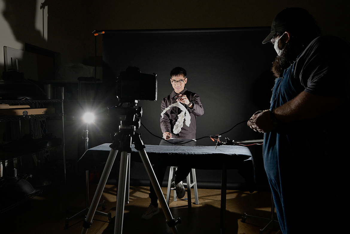 Zach Vongsiharath, a senior at Blackman Collegiate Academy, is photographed bursting a balloon during a visit to the photography facilities in the McFarland Building. Vongsiharath was part of a group of BCA students who toured MTSU Oct. 21. (MTSU photo by Andy Heidt)