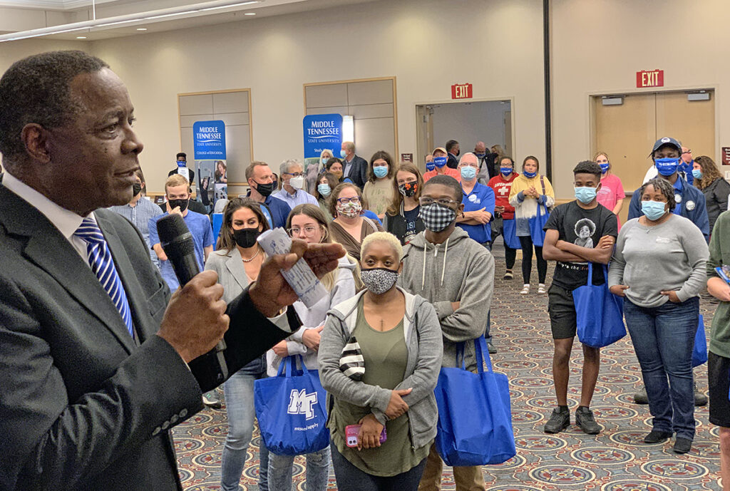 MTSU President Sidney A. McPhee, right, talks to prospective students and their parents attending the True Blue Tour event recently at the Chattanooga Convention Center. The students and family members came from across the area, seeking information about the university to help them make their decision on a college choice. Numerous MTSU academic colleges and other departments answered questions and provided material they can take with them. (MTSU photo by Randy Weiler)