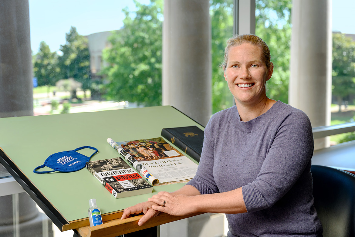 Health communications expert Katie Foss, pictured here with her book “Constructing the Outbreak: Epidemics in Media and Collective Memory,” is an MTSU professor of media studies in the School of Journalism and Strategic Media in the College of Media and Entertainment. She will lead a discussion on Tennessee’s history of epidemics and how the media documented outbreaks that shaped the state’s history in the Oct. 13 Lunch and Learn event at the Tennessee State Museum in Nashville. (MTSU photo by J. Intintoli)